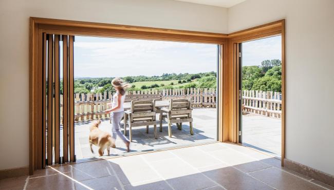 Centor folding doors creating a seamless open living plan for a renovated farmhouse