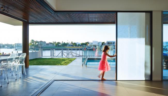 207 Cornerless post-free folding door with built in shade for control of sun glare